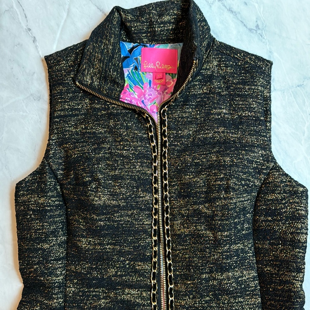 Black vest with gold details